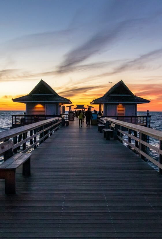 dock with a sunset in the background